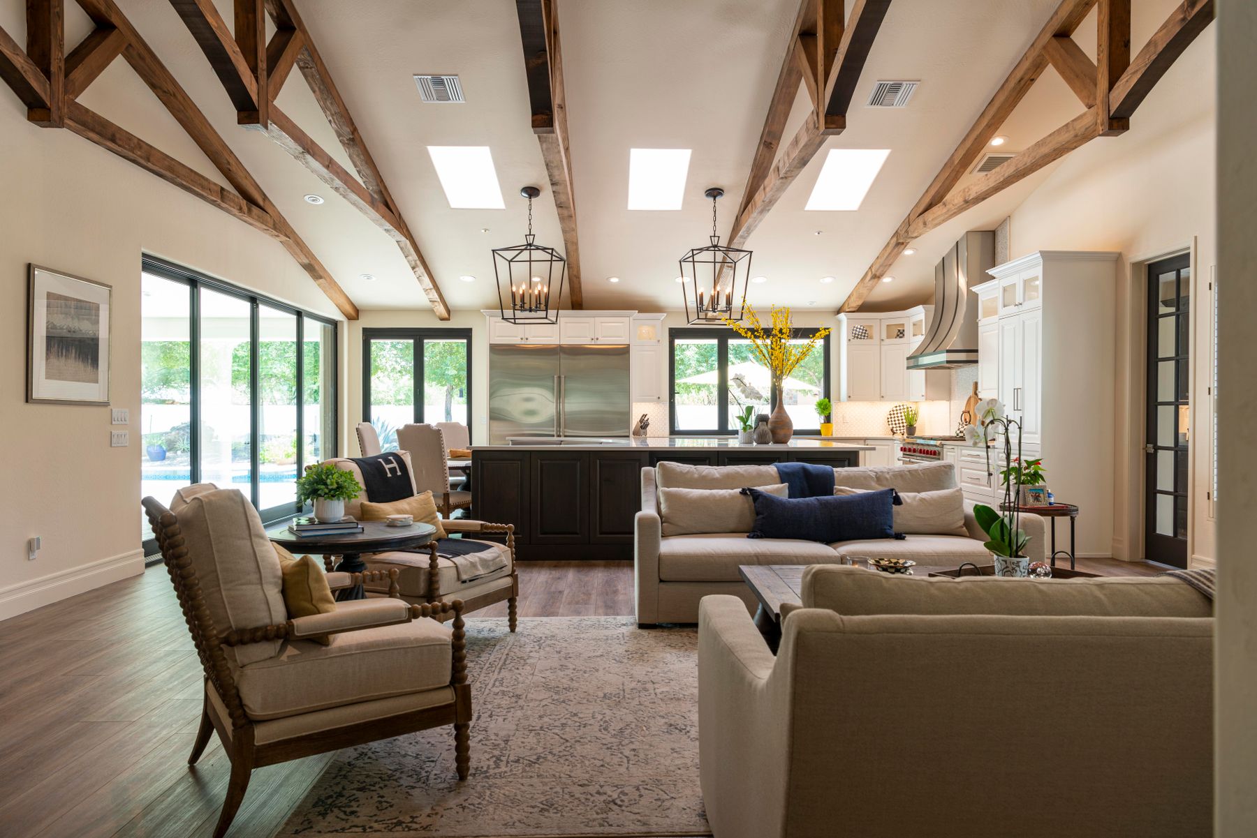 Warm living room with wood beams and neutral furnishings